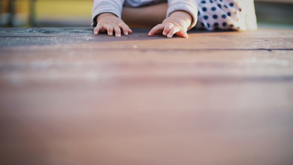 child in white and black polka dot pants and white socks