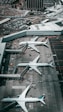 white and gray airplane on airport during daytime