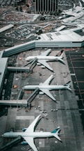 white and gray airplane on airport during daytime