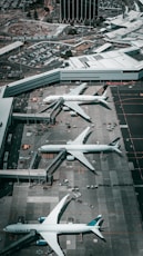 white and gray airplane on airport during daytime