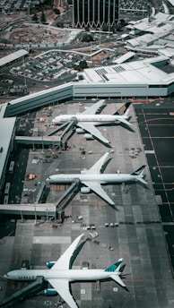 white and gray airplane on airport during daytime