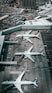 white and gray airplane on airport during daytime