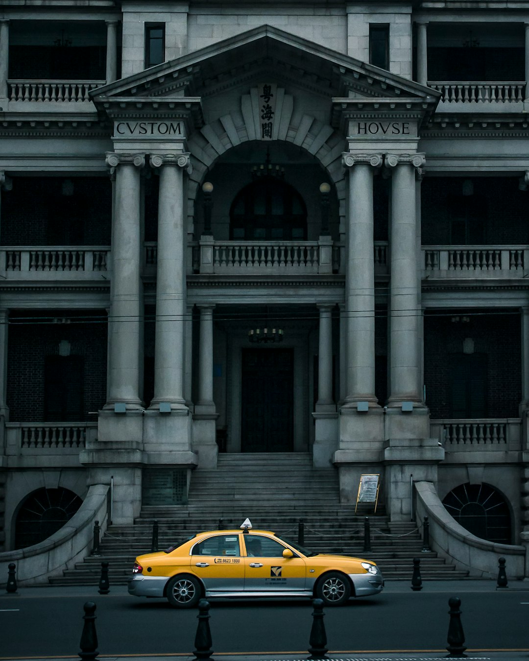 yellow porsche 911 parked near white concrete building during daytime