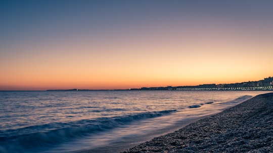 sea waves crashing on shore during sunset in Nice France