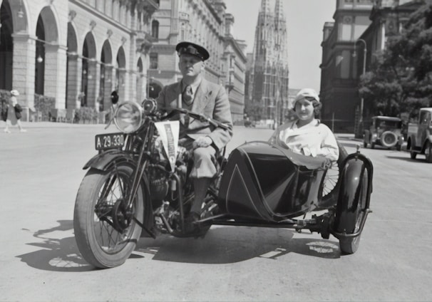 man in black suit riding on black motorcycle