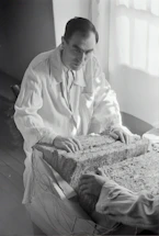 A professional engineer reviewing structural test results in a modern lab.