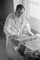 A team member analyzing core samples in the modern lab at geovista consulting.