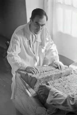 A professional engineer reviewing structural test results in a modern lab.