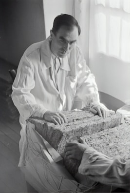 Technician inspecting a concrete slab in the Tamoyo factory laboratory.