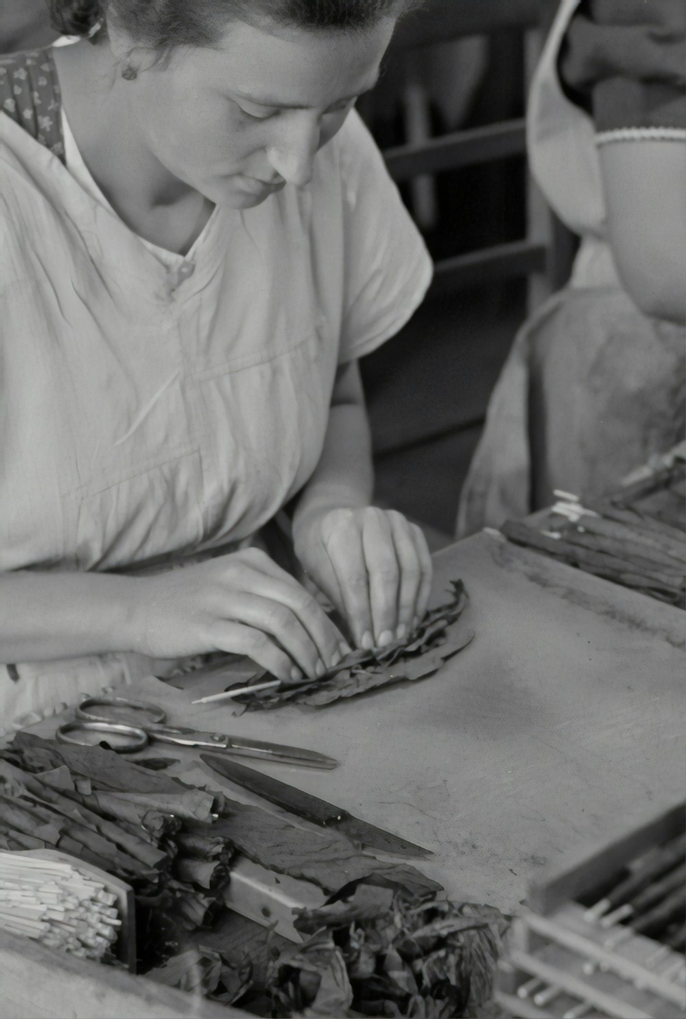 woman in white long sleeve shirt holding silver fork