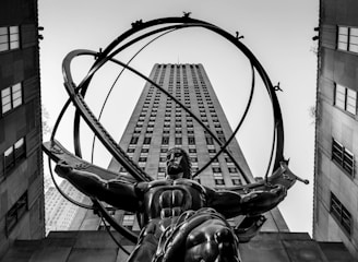 grayscale photo of man riding horse statue