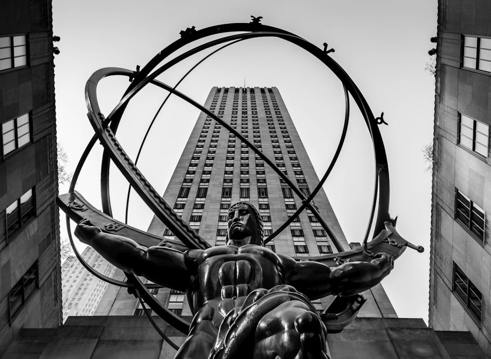 grayscale photo of man riding horse statue