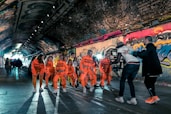 group of people in orange and white shirts