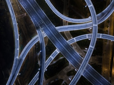 Clean, modern depiction of a digital road network resembling neural pathways.