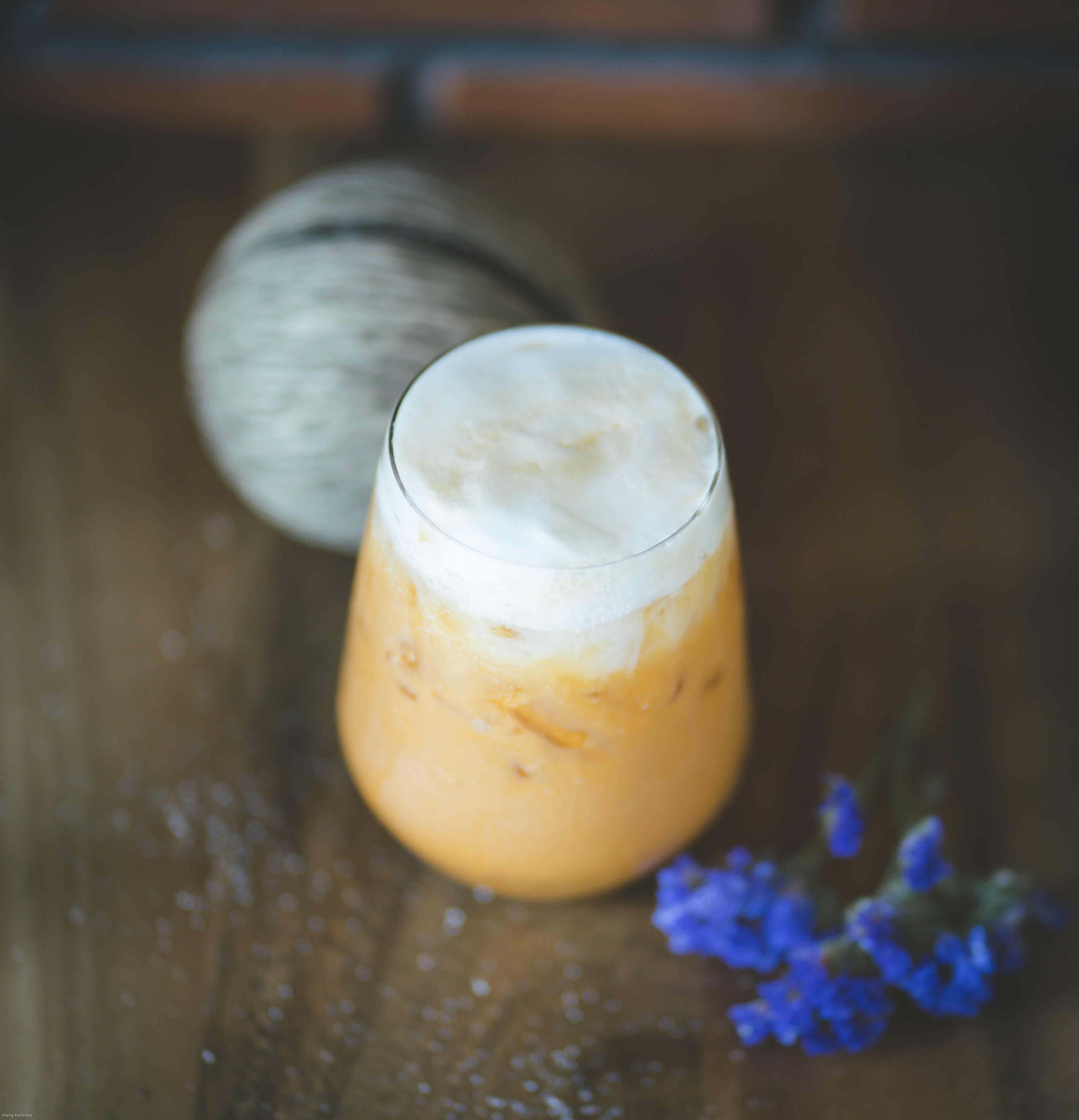 orange candle on brown wooden table