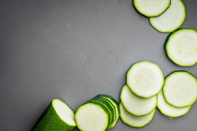sliced cucumber on gray textile produce zoom background