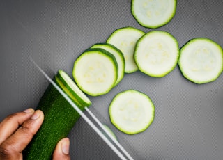 sliced cucumber on black textile