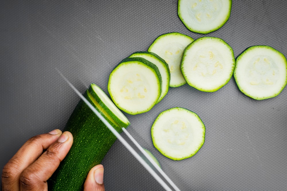 sliced cucumber on black textile