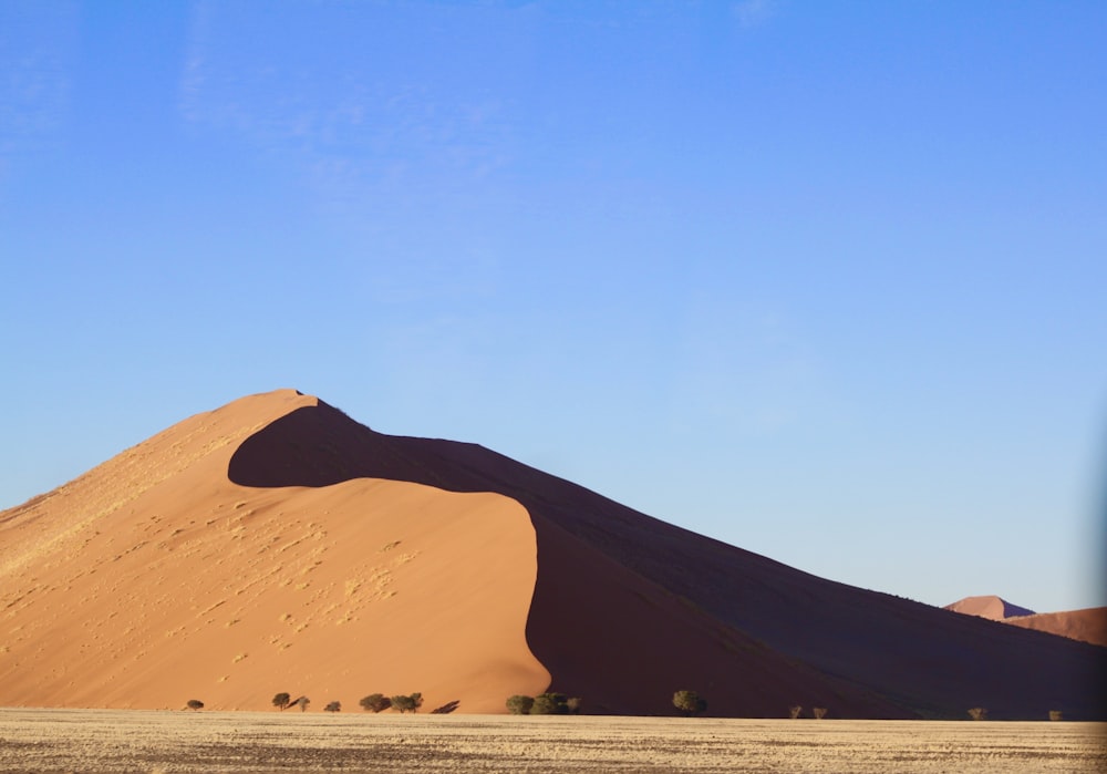 brown mountain under blue sky during daytime