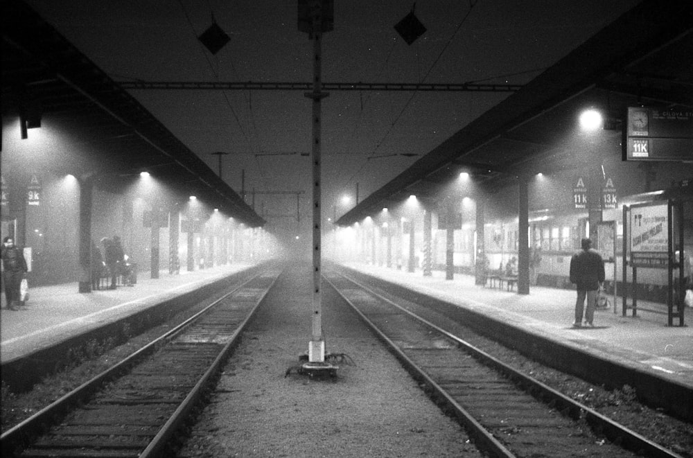 grayscale photo of train rail