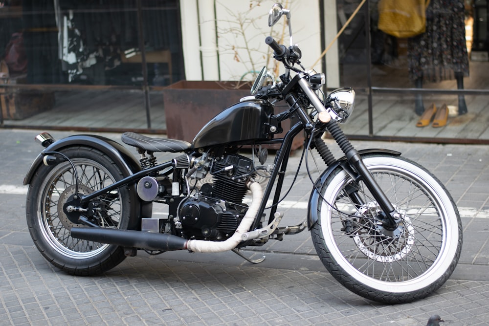 a black motorcycle parked on the side of the road