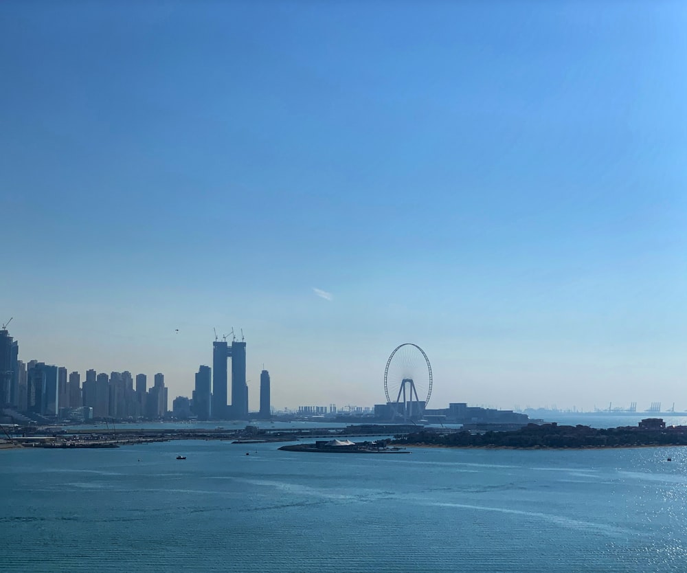 city skyline across body of water during daytime