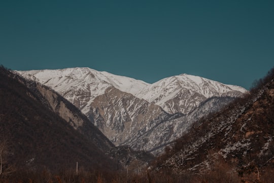 snow covered mountains during daytime in Shaki Azerbaijan