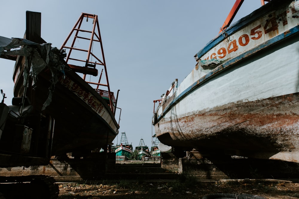 white and brown boat on sea dock during daytime