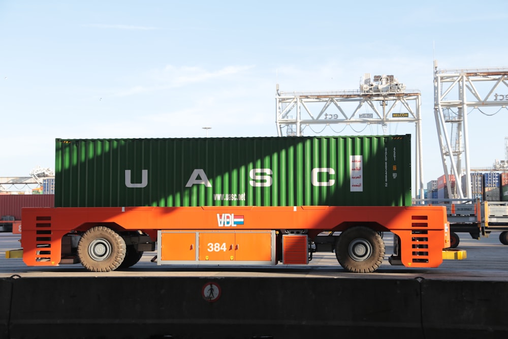 orange and green cargo truck
