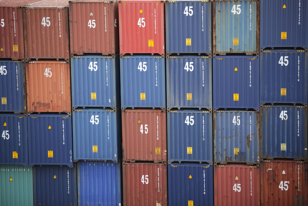stack of red and blue intermodal containers