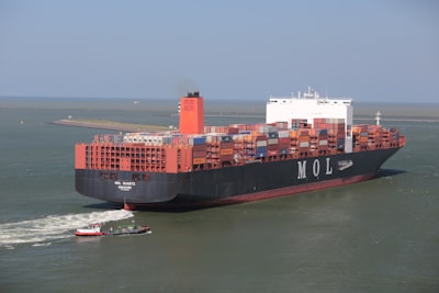 cargo ship on sea under gray sky during daytime transportation google meet background