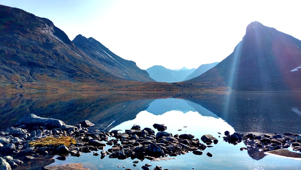 rocky mountain near lake during daytime