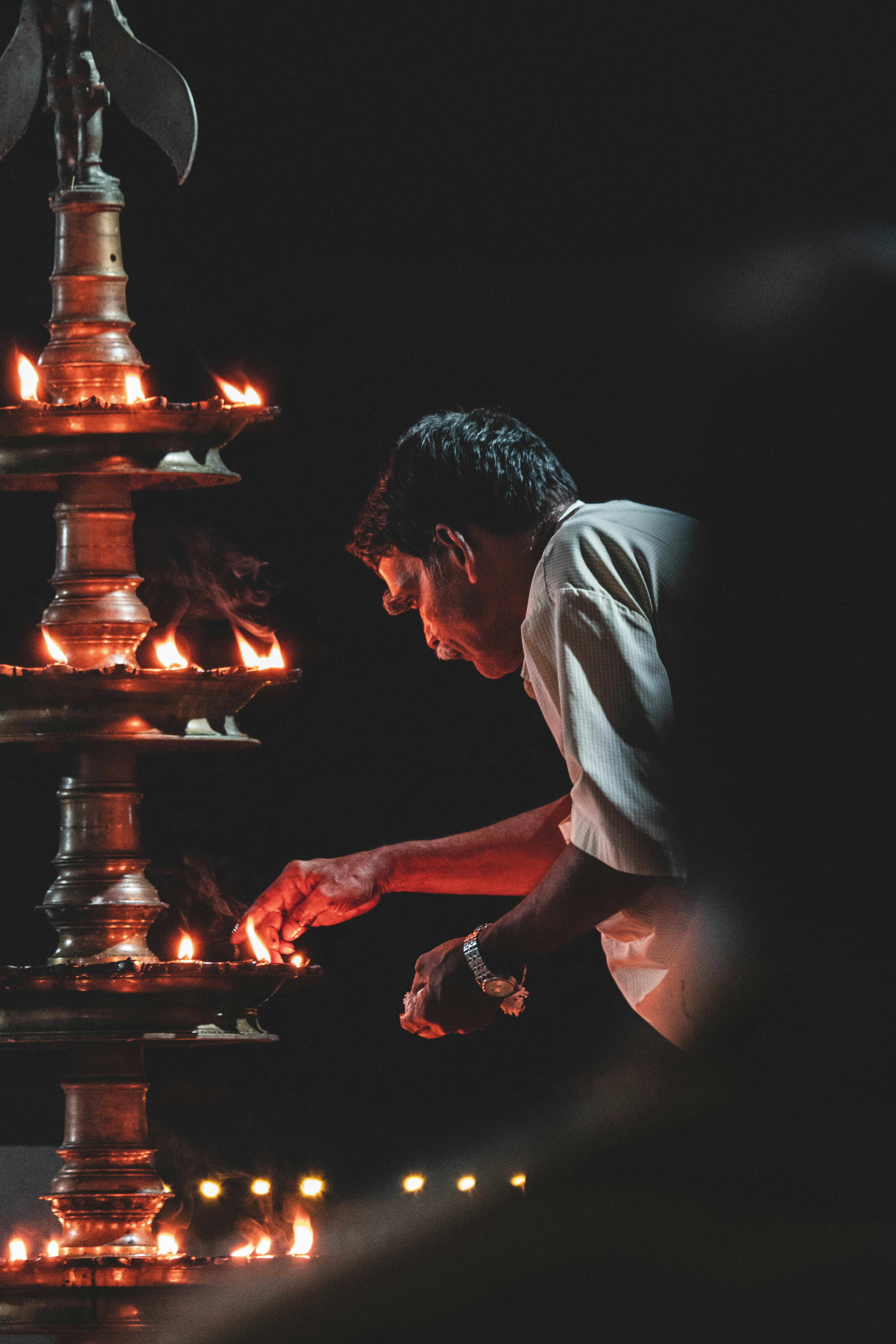man in white t-shirt sitting on chair