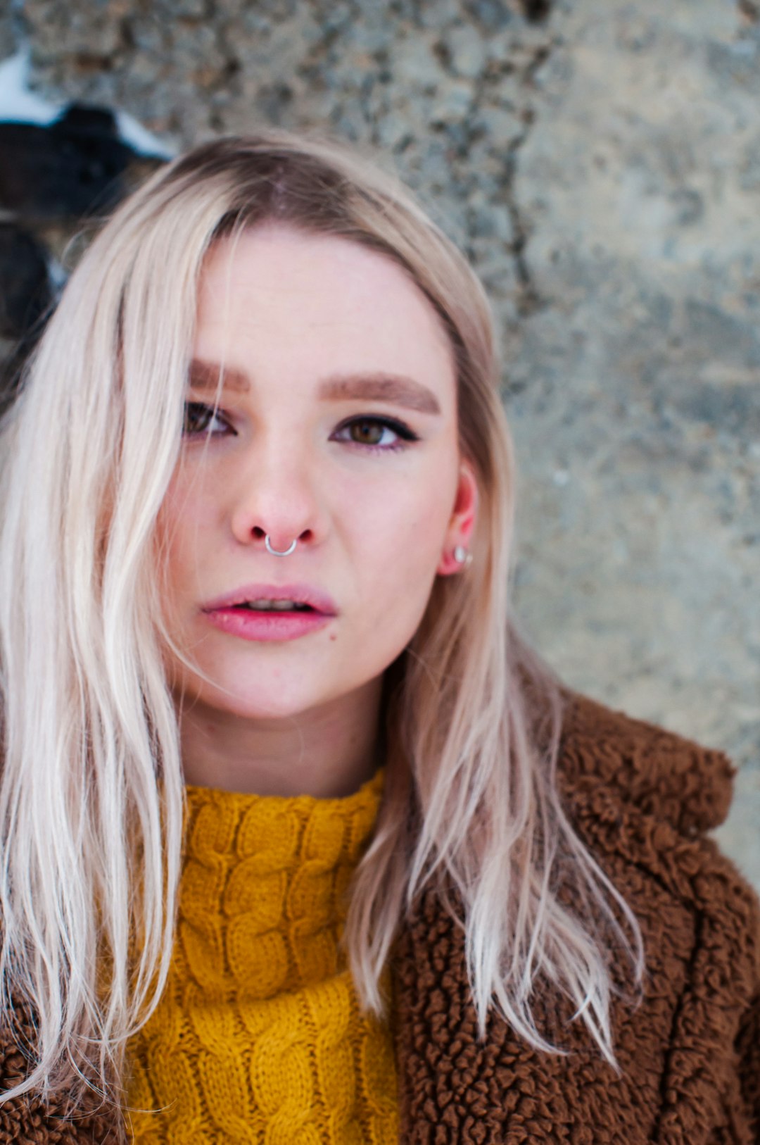 woman in yellow knit sweater