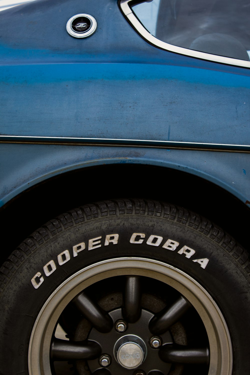 blue car with black wheel