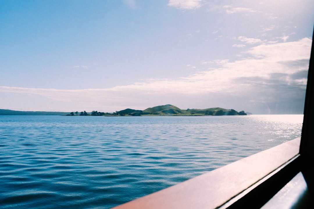 body of water under blue sky during daytime