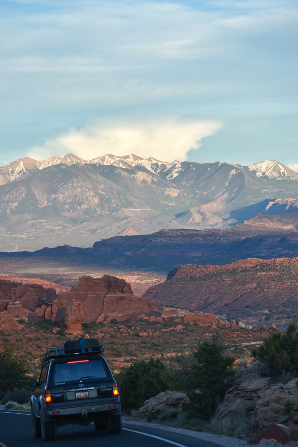 black and blue camping tent on brown rocky mountain during daytime