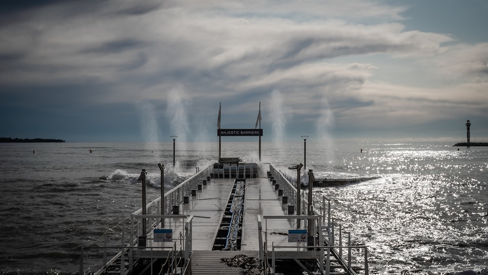 brown wooden dock on sea during daytime