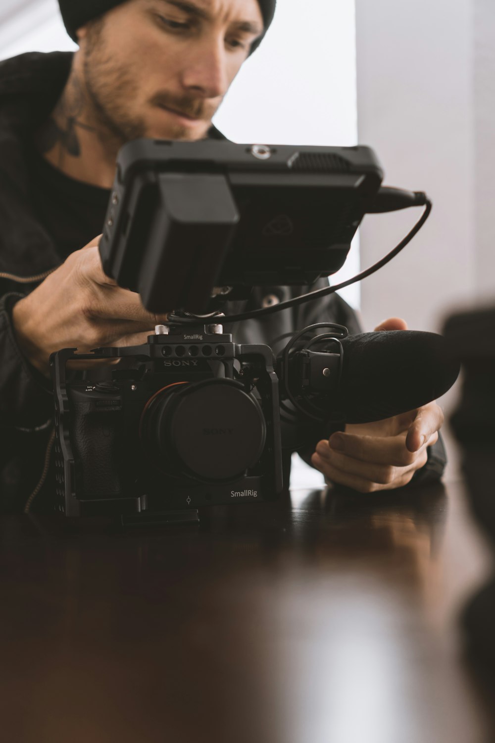 person holding black dslr camera