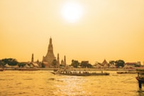 people walking on bridge over body of water during daytime