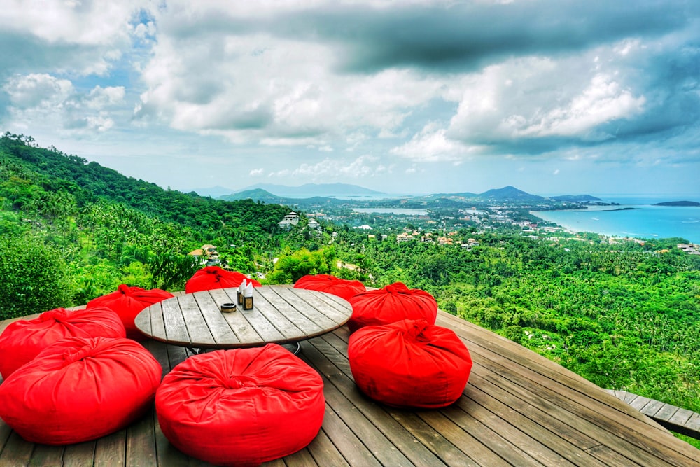 red and white kayak on brown wooden dock