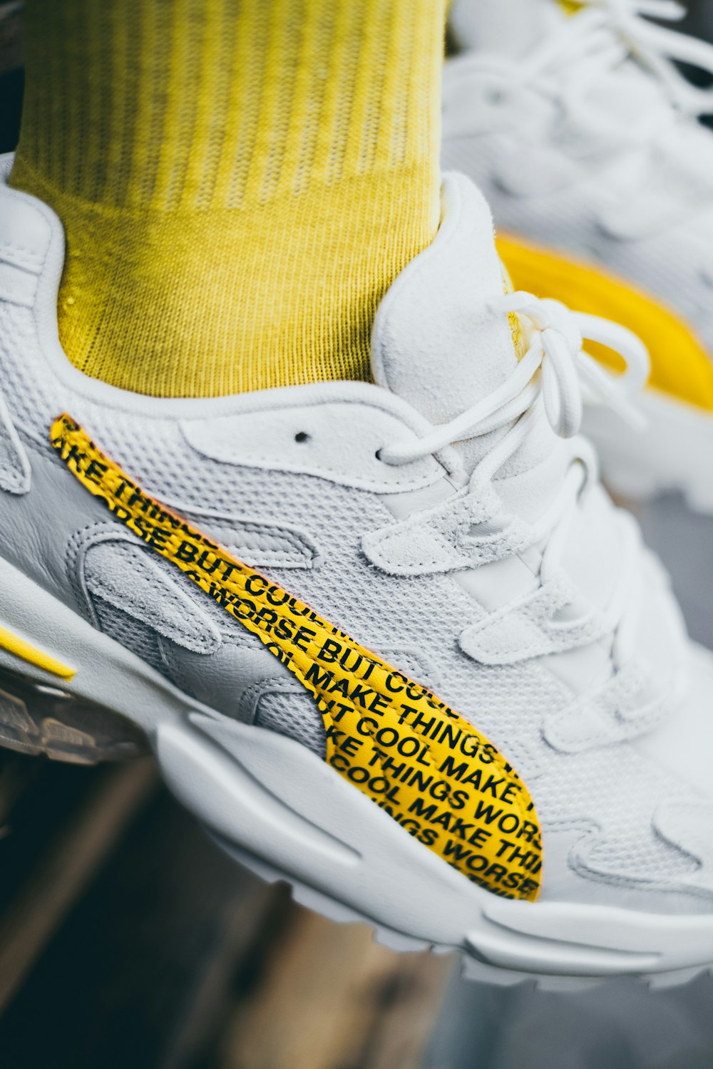 white and yellow nike athletic shoes photo – Free Fashion Image on Unsplash