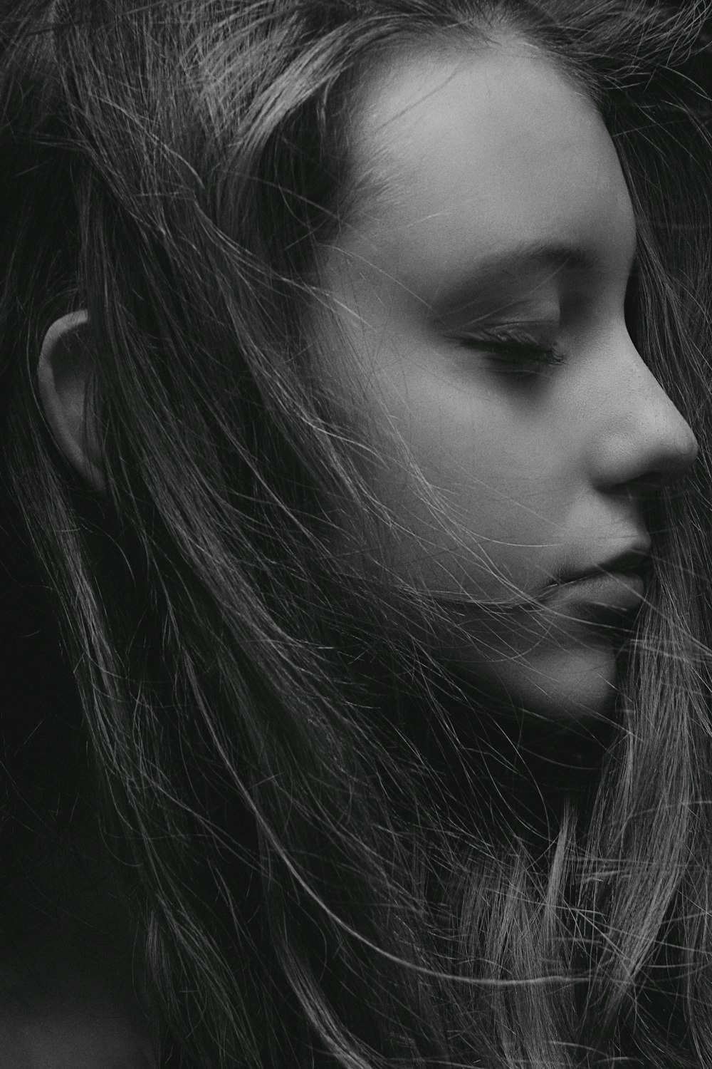 grayscale photo of womans face