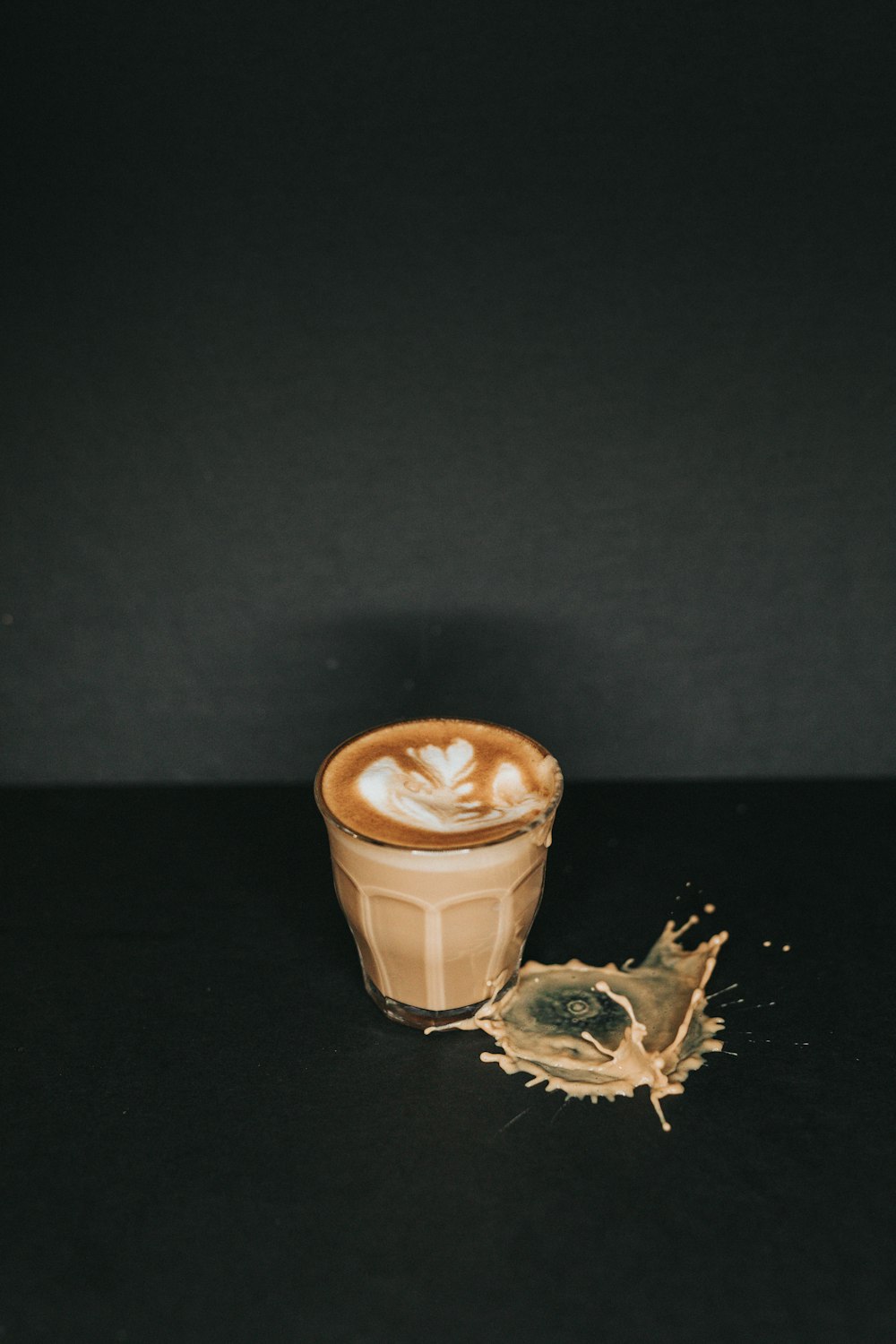 white ceramic mug with brown liquid