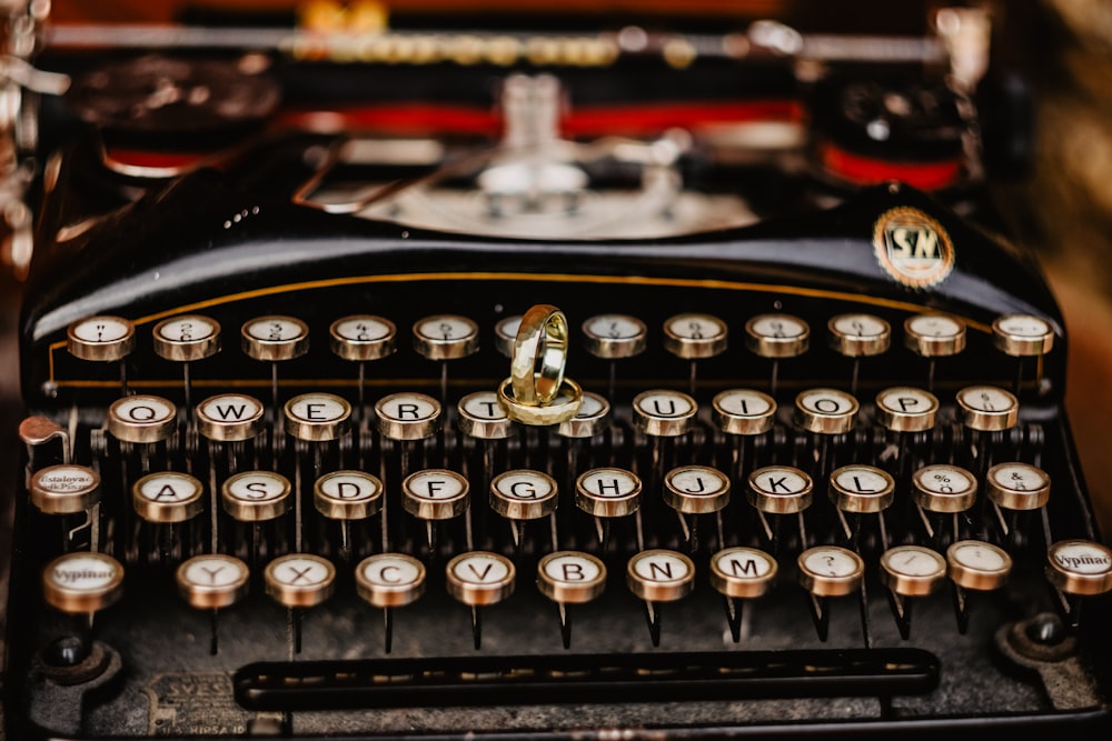 black and silver typewriter on table