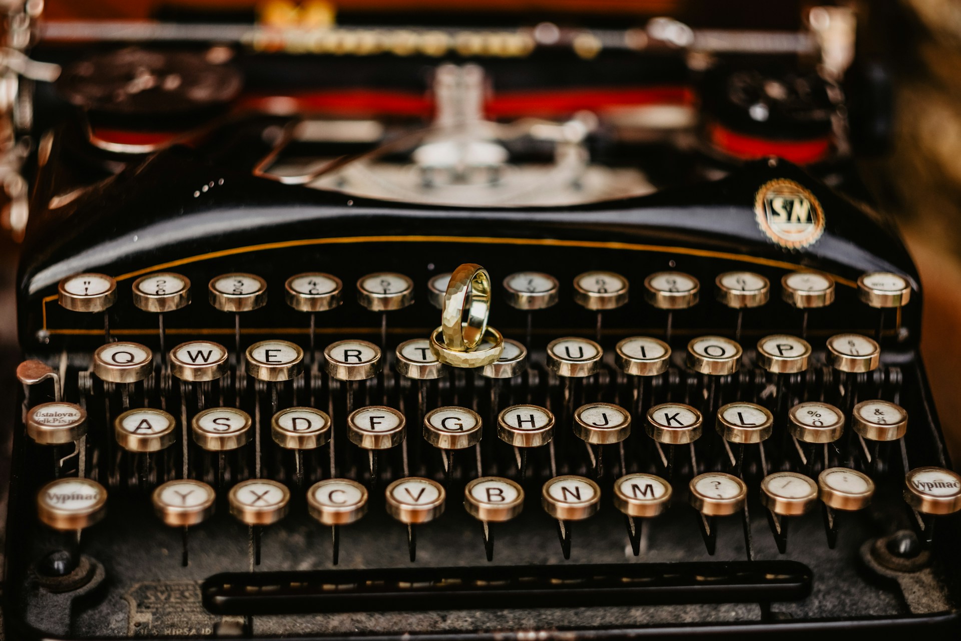 black and silver typewriter on table