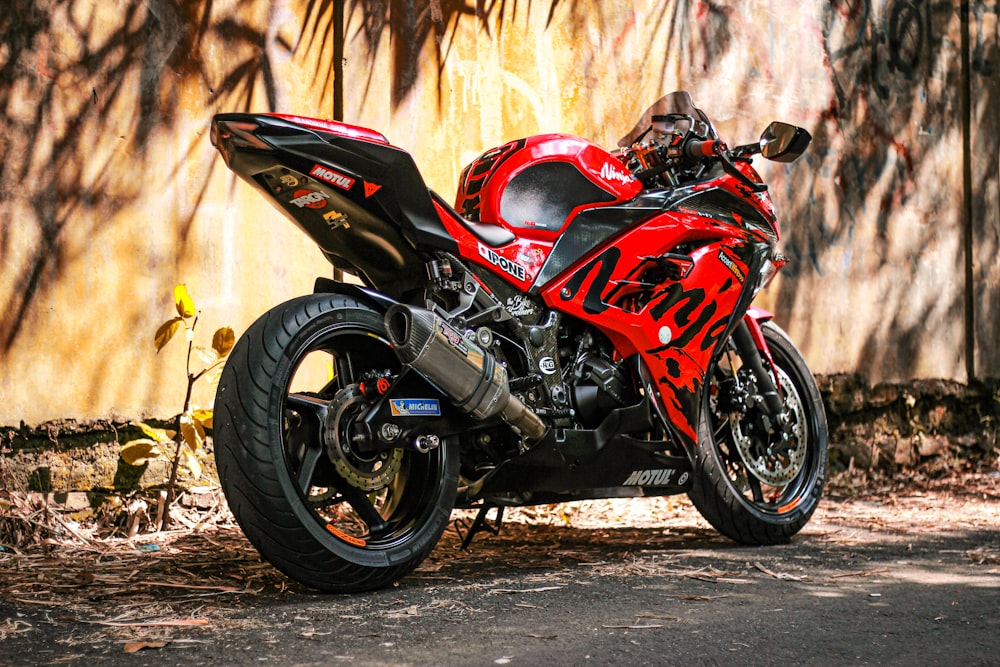 red and black sports bike