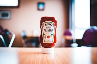heinz tomato ketchup bottle on brown wooden table