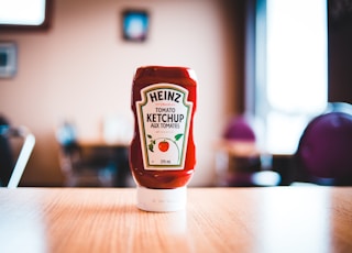 heinz tomato ketchup bottle on brown wooden table