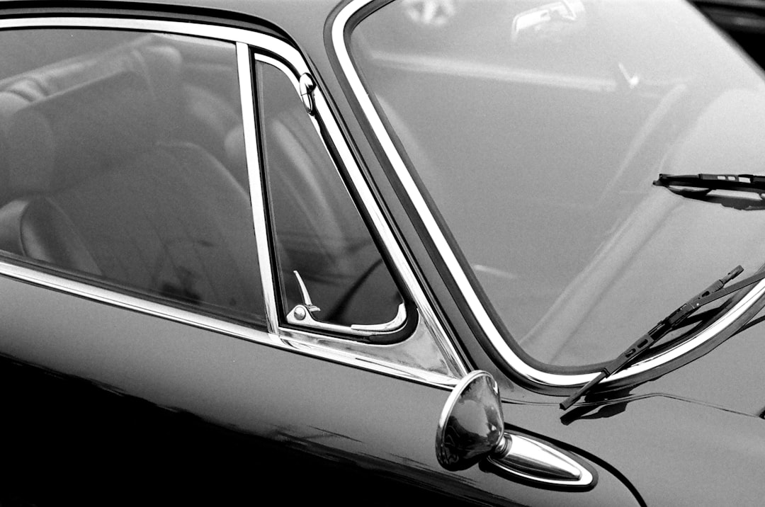 grayscale photo of car side mirror